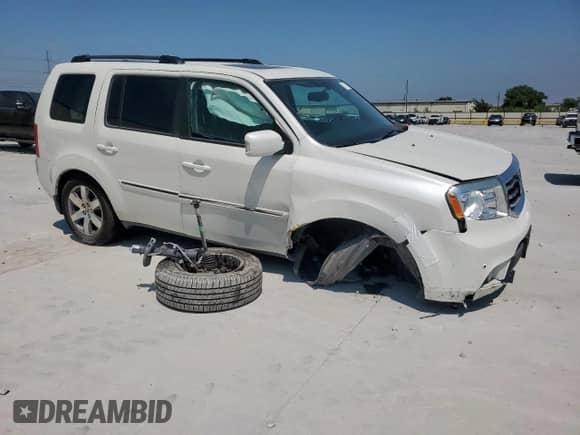 2014 Honda Pilot Touring with VIN 5FNYF3H94EB011727, listed as a Copart auction lot 67771195 with 53,721 mi miles and Salvage title. Bid and sale history available at DreamBid. Image 4.
