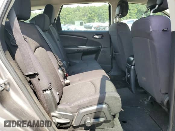 2012 Dodge Journey American Value with VIN 3C4PDCABXCT367581, listed as a Copart auction lot 71170095 with 191,484 mi miles and Salvage title. Bid and sale history available at DreamBid. Image 11.