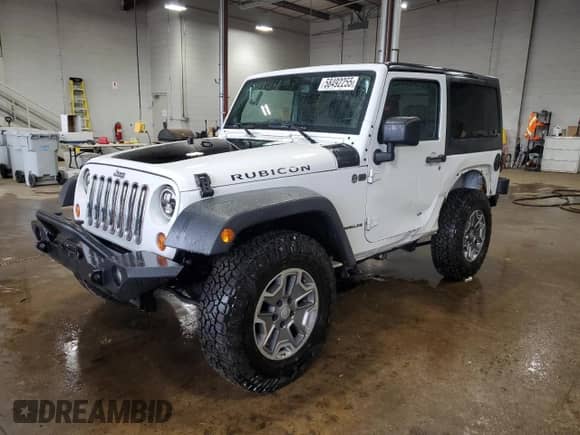 2013 Jeep Wrangler Rubicon 10th Anniversary with VIN 1C4BJWCGXDL543958, listed as a Copart auction lot 58492255 with 94,455 mi miles and Salvage title. Bid and sale history available at DreamBid. Image 1.