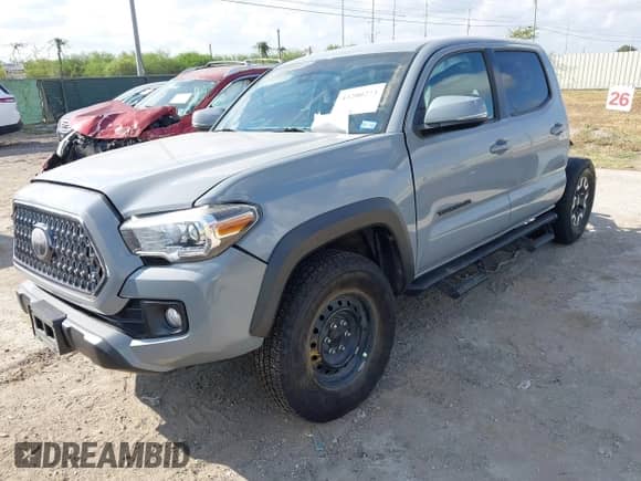 2019 Toyota Tacoma TRD Off Road with VIN 3TMCZ5AN9KM279023, listed as a IAAI auction lot 43200273 with 68,836 mi miles and . Bid and sale history available at DreamBid. Image 18.