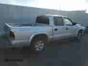 2004 Dodge Dakota Sport z VIN 1D7HL38N44S573883, wystawiony jako Copart lot #74955984 z przebiegiem 165 510 mil mil oraz Szkoda całkowita • Salvage title. Historia ofert i sprzedaży dostępna na DreamBid. Obrazek 3.