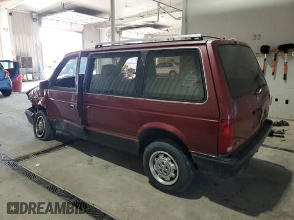 1989 Dodge Caravan with VIN 2B4FK553XKR379082, listed as a Copart auction lot 71077325 with 163,844 mi miles and Salvage title. Bid and sale history available at DreamBid. Image 2.