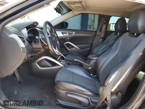 2013 Hyundai Veloster w/Black Int z VIN KMHTC6AD2DU153014, wystawiony jako Copart lot #84975285 z przebiegiem 128 446 mil mil oraz Szkoda całkowita • Salvage title. Historia ofert i sprzedaży dostępna na DreamBid. Obrazek 7.