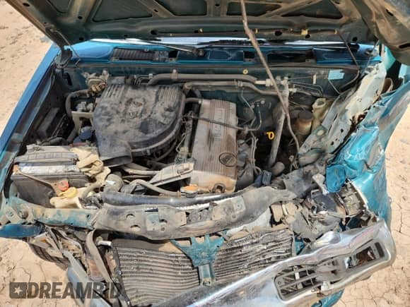 1997 Nissan Frontier XE with VIN 1N6SD11S5VC336667, listed as a Copart auction lot 64675695 with 179,754 mi miles and Salvage title. Bid and sale history available at DreamBid. Image 11.