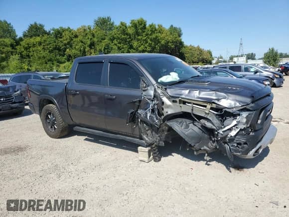 2020 Ram 1500 Rebel z VIN 1C6SRFLT0LN233317, wystawiony jako Copart lot #70363135 z przebiegiem 124 850 mil mil oraz Szkoda całkowita • Salvage title. Historia ofert i sprzedaży dostępna na DreamBid. Obrazek 4.