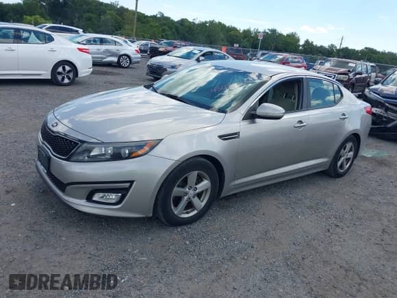 2015 Kia Optima LX with VIN 5XXGM4A75FG379610, listed as a IAAI auction lot 43074307 with 121,698 mi miles and . Bid and sale history available at DreamBid. Image 2.