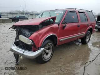 2000 Chevrolet Blazer LS z VIN 1GNCS13W5Y2155227, wystawiony jako Copart lot #43950875 z przebiegiem 153 365 mil mil oraz Nie do naprawy • Non repairable. Historia ofert i sprzedaży dostępna na DreamBid. Obrazek 1.