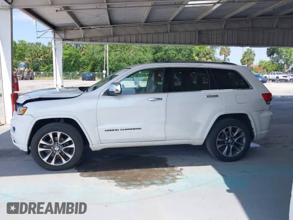 2018 Jeep Grand Cherokee Overland with VIN 1C4RJFCG8JC229381, listed as a IAAI auction lot 42221266 with 102,230 mi miles and . Bid and sale history available at DreamBid. Image 14.