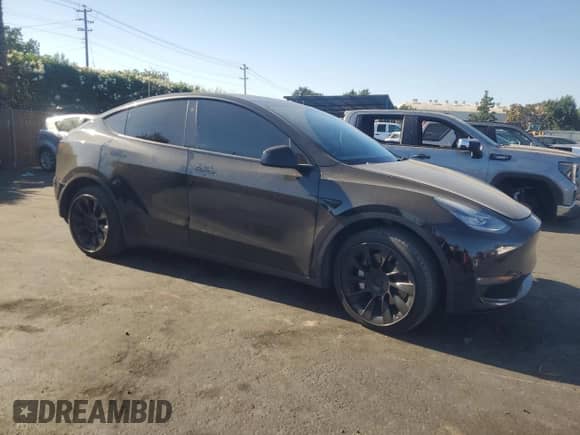 2021 Tesla Model Y Long Range with VIN 5YJYGDEE5MF214760, listed as a Copart auction lot 71198945 with 103,622 mi miles and Salvage title. Bid and sale history available at DreamBid. Image 4.