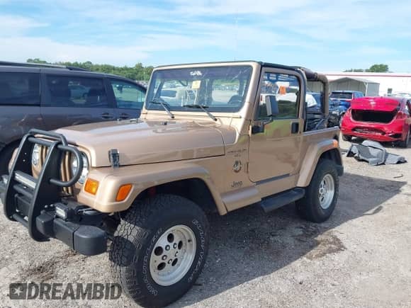 1999 Jeep Wrangler Sahara с VIN 1J4FY49S1XP428301, выставлен на аукционе IAAI как лот 43193956 с пробегом 55 579 миль миль и . История ставок и продаж доступна на DreamBid. Изображение 2.