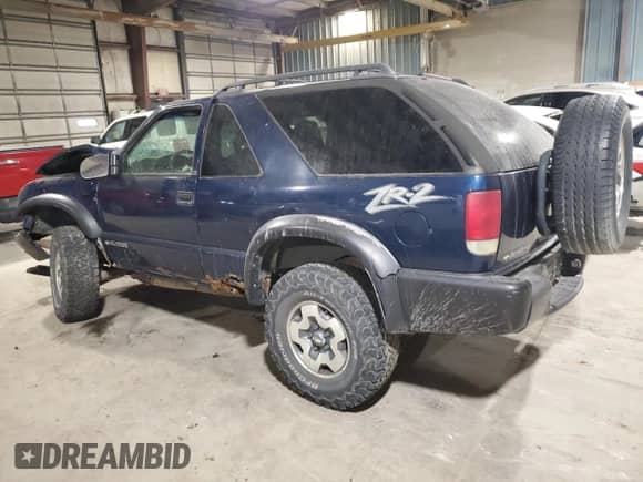 2001 Chevrolet Blazer LS z VIN 1GNCT18W01K143093, wystawiony jako Copart lot #82650514 z przebiegiem Nie podano mil oraz Szkoda całkowita • Salvage title. Historia ofert i sprzedaży dostępna na DreamBid. Obrazek 2.
