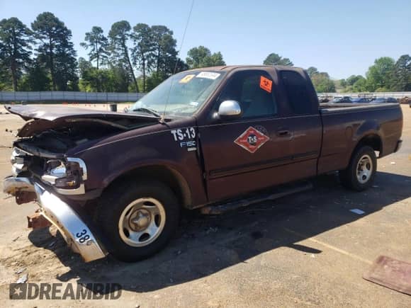 2000 Ford F-150 XL z VIN 1FTRX17L8YNA43816, wystawiony jako Copart lot #79871834 z przebiegiem 214 982 mil mil oraz Szkoda całkowita • Salvage title. Historia ofert i sprzedaży dostępna na DreamBid. Obrazek 1.