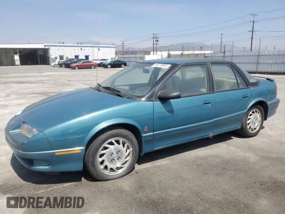 1994 Saturn SL с VIN 1G8ZK5571RZ301061, выставлен на аукционе Copart как лот 55270685 с пробегом 31 990 миль миль и Чистый • Clean title. История ставок и продаж доступна на DreamBid. Изображение 1.