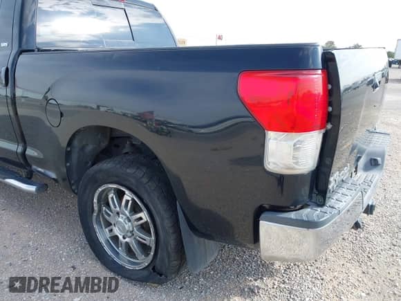 2013 Toyota Tundra z VIN 5TFUW5F12DX290297, wystawiony jako IAAI lot #39989353 z przebiegiem 98 212 mil mil oraz . Historia ofert i sprzedaży dostępna na DreamBid. Obrazek 6.