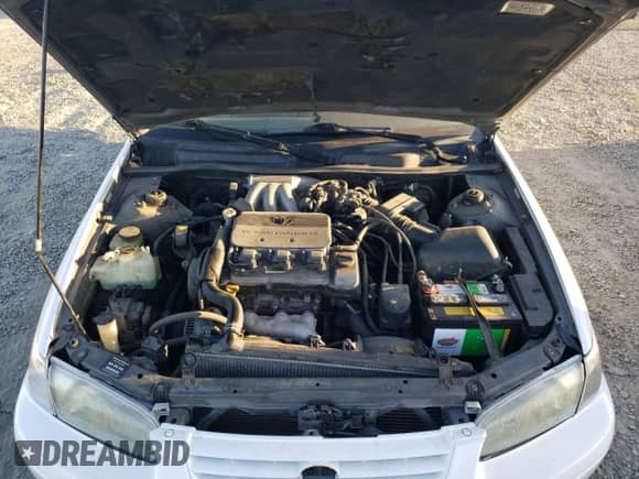 1997 Toyota Camry LE z VIN 4T1BF22K4VU009099, wystawiony jako Copart lot #68046605 z przebiegiem 177 037 mil mil oraz Szkoda całkowita • Salvage title. Historia ofert i sprzedaży dostępna na DreamBid. Obrazek 11.