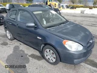 2010 Hyundai Accent GS z VIN KMHCM3AC3AU180348, wystawiony jako IAAI lot #41735911 z przebiegiem 151 946 mil mil oraz . Historia ofert i sprzedaży dostępna na DreamBid. Obrazek 1.