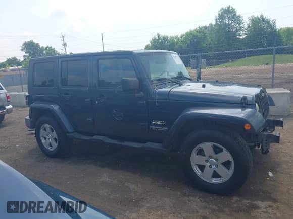 2007 Jeep Wrangler Unlimited Sahara z VIN 1J4GA591X7L117415, wystawiony jako IAAI lot #42509979 z przebiegiem 96 192 mil mil oraz . Historia ofert i sprzedaży dostępna na DreamBid. Obrazek 14.