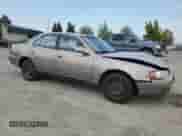 1996 Toyota Camry DX z VIN JT2BG12K9T0371115, wystawiony jako Copart lot #70061945 z przebiegiem 274 613 mil mil oraz Szkoda całkowita • Salvage title. Historia ofert i sprzedaży dostępna na DreamBid. Obrazek 4.