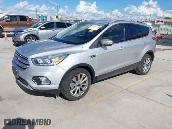 2017 Ford Escape Titanium z VIN 1FMCU9J99HUA96018, wystawiony jako IAAI lot #43283014 z przebiegiem Nie podano mil oraz . Historia ofert i sprzedaży dostępna na DreamBid. Obrazek 2.