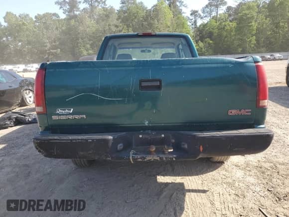 1998 GMC Sierra 1500 z VIN 1GTEC19W4WE521888, wystawiony jako Copart lot #53161505 z przebiegiem 985 004 mil mil oraz Szkoda całkowita • Salvage title. Historia ofert i sprzedaży dostępna na DreamBid. Obrazek 6.