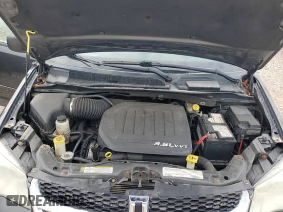 2012 Dodge Grand Caravan American Value z VIN 2C4RDGBG7CR148235, wystawiony jako Copart lot #81545825 z przebiegiem 167 455 mil mil oraz Czysty tytuł • Clean title. Historia ofert i sprzedaży dostępna na DreamBid. Obrazek 12.