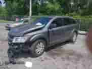 2013 Dodge Journey American Value z VIN 3C4PDCAB1DT710523, wystawiony jako IAAI lot #42997519 z przebiegiem 162 129 mil mil oraz . Historia ofert i sprzedaży dostępna na DreamBid. Obrazek 2.