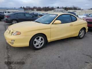 2001 Hyundai Tiburon с VIN KMHJG35F01U231789, выставлен на аукционе Copart как лот 88988265 с пробегом 106 946 миль миль и Чистый • Clean title. История ставок и продаж доступна на DreamBid. Изображение 1.