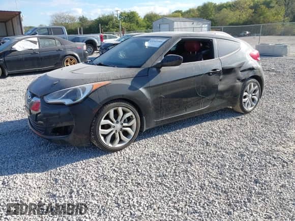 2012 Hyundai Veloster w/Black Int z VIN KMHTC6AD3CU053566, wystawiony jako IAAI lot #43349585 z przebiegiem 137 240 mil mil oraz . Historia ofert i sprzedaży dostępna na DreamBid. Obrazek 2.
