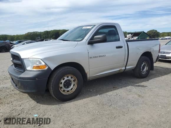 2012 Ram 1500 ST with VIN 3C6JD6AK1CG185842, listed as a Copart auction lot 80997775 with 123,516 mi miles and Clean title. Bid and sale history available at DreamBid. Image 1.