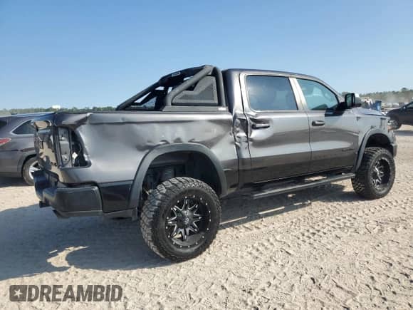 2020 Ram 1500 Rebel z VIN 1C6SRFLT2LN199221, wystawiony jako Copart lot #87314775 z przebiegiem 49 714 mil mil oraz Szkoda całkowita • Salvage title. Historia ofert i sprzedaży dostępna na DreamBid. Obrazek 3.