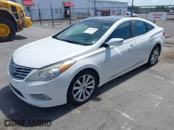 2014 Hyundai Azera Limited z VIN KMHFH4JG9EA353114, wystawiony jako IAAI lot #42757597 z przebiegiem 122 604 mil mil oraz . Historia ofert i sprzedaży dostępna na DreamBid. Obrazek 2.