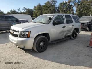 2011 Chevrolet Tahoe Commercial z VIN 1GNLC2E02BR306292, wystawiony jako Copart lot #44136095 z przebiegiem 172 104 mil mil oraz Szkoda całkowita • Salvage title. Historia ofert i sprzedaży dostępna na DreamBid. Obrazek 1.