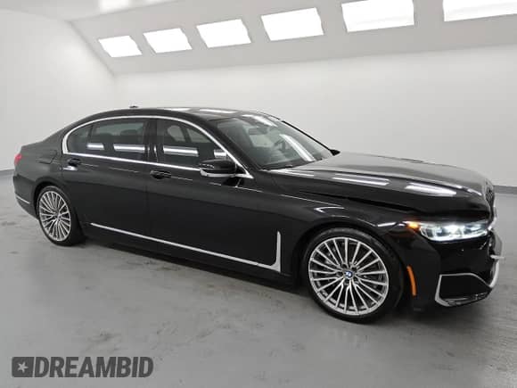 2020 BMW 7 Series 740i with VIN WBA7T2C07LCD04975, listed as a Copart auction lot 60989495 with 121,769 mi miles and Clean title. Bid and sale history available at DreamBid. Image 4.
