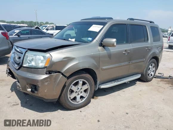 2009 Honda Pilot Touring with VIN 5FNYF38809B004142, listed as a IAAI auction lot 42337103 with 152,874 mi miles and . Bid and sale history available at DreamBid. Image 2.