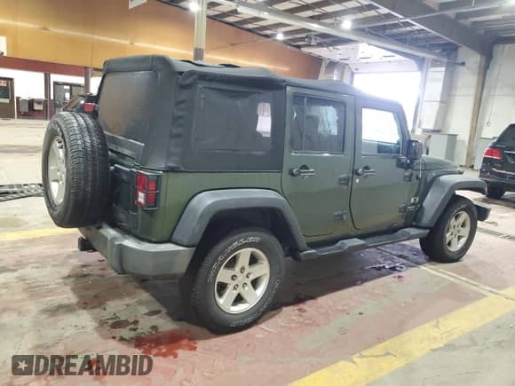 2008 Jeep Wrangler Unlimited X with VIN 1J4GA39158L583789, listed as a Copart auction lot 86292065 with 170,334 mi miles and Salvage title. Bid and sale history available at DreamBid. Image 3.