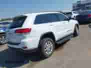 2022 Jeep Grand Cherokee Laredo X with VIN 1C4RJFAG3NC151696, listed as a IAAI auction lot 43137250 with 21,521 mi miles and . Bid and sale history available at DreamBid. Image 4.