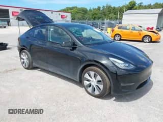 2021 Tesla Model Y Long Range with VIN 5YJYGAEE8MF207493, listed as a IAAI auction lot 43261396 with 49,440 mi miles and . Bid and sale history available at DreamBid. Image 1.