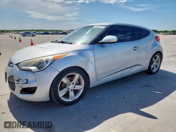 2012 Hyundai Veloster w/Red Int z VIN KMHTC6ADXCU036716, wystawiony jako Copart lot #63408115 z przebiegiem 144 117 mil mil oraz Szkoda całkowita • Salvage title. Historia ofert i sprzedaży dostępna na DreamBid. Obrazek 1.