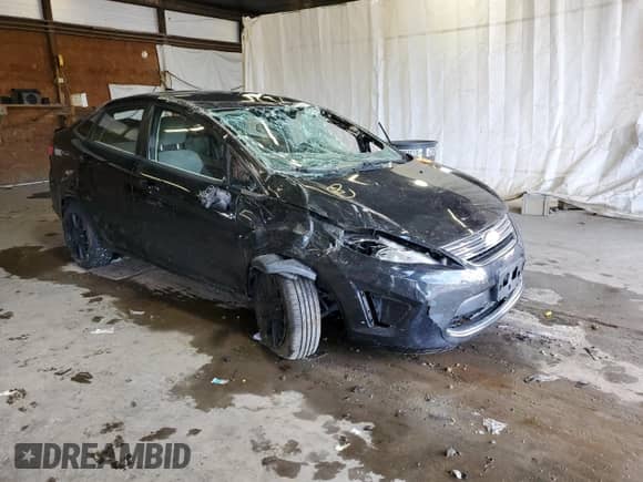 2011 Ford Fiesta S with VIN 3FADP4AJ7BM232421, listed as a Copart auction lot 69362695 with 142,734 mi miles and Salvage title. Bid and sale history available at DreamBid. Image 4.