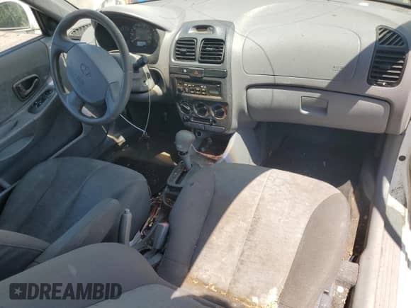 2005 Hyundai Accent GLS с VIN KMHCG35C75U353506, выставлен на аукционе Copart как лот 63022545 с пробегом 143 246 миль миль и Списание • Salvage title. История ставок и продаж доступна на DreamBid. Изображение 8.