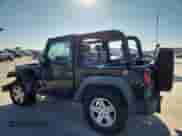 2010 Jeep Wrangler Sport z VIN 1J4AA2D17AL177686, wystawiony jako Copart lot #86880875 z przebiegiem 135 820 mil mil oraz Szkoda całkowita • Salvage title. Historia ofert i sprzedaży dostępna na DreamBid. Obrazek 2.