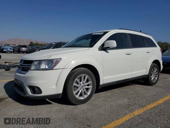 2014 Dodge Journey SXT with VIN 3C4PDCBB7ET119077, listed as a Copart auction lot 68337365 with 99,909 mi miles and Salvage title. Bid and sale history available at DreamBid. Image 1.
