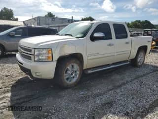 2013 Chevrolet Silverado 1500 LTZ with VIN 3GCPKTE75DG151143, listed as a Copart auction lot 70095165 with 123,467 mi miles and Salvage title. Bid and sale history available at DreamBid. Image 1.