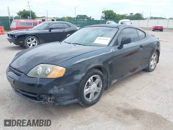 2003 Hyundai Tiburon GT с VIN KMHHN65F63U072432, выставлен на аукционе IAAI как лот 42813911 с пробегом 162 894 миль миль и . История ставок и продаж доступна на DreamBid. Изображение 17.