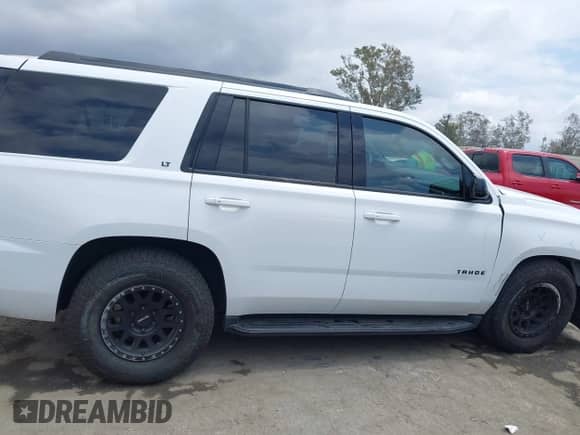 2020 Chevrolet Tahoe LT with VIN 1GNSCBKC0LR290170, listed as a IAAI auction lot 42129712 with 57,414 mi miles and . Bid and sale history available at DreamBid. Image 13.