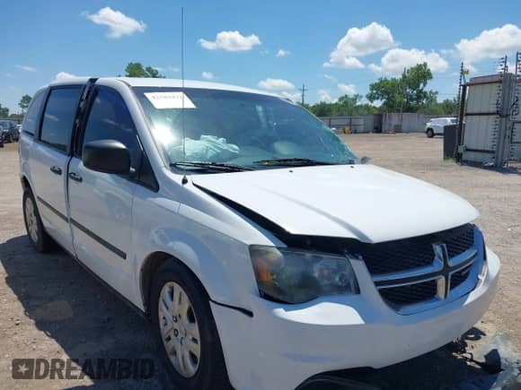 2014 Dodge Grand Caravan SE with VIN 2C4RDGBG0ER450775, listed as a IAAI auction lot 42589472 with 11 mi miles and . Bid and sale history available at DreamBid. Image 1.