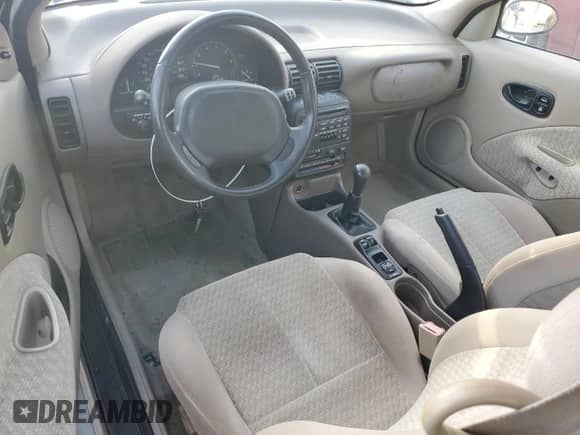 1999 Saturn SC with VIN 1G8ZR1275XZ375833, listed as a Copart auction lot 87960885 with 97,697 mi miles and Salvage title. Bid and sale history available at DreamBid. Image 8.