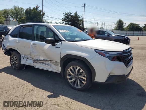 2025 Subaru Forester Touring Hybrid with VIN JF2SLSTD5SH402161, listed as a Copart auction lot 69202285 with 1,796 mi miles and Salvage title. Bid and sale history available at DreamBid. Image 4.