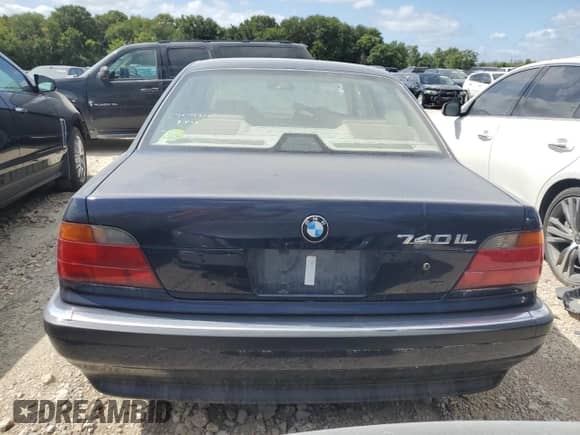 1997 BMW 7 Series 740iL with VIN WBAGJ8324VDM02317, listed as a Copart auction lot 64879564 with 107,365 mi miles and Salvage title. Bid and sale history available at DreamBid. Image 6.