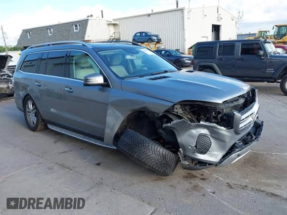 2017 Mercedes-Benz GLS 450 with VIN 4JGDF6EE6HA770387, listed as a IAAI auction lot 43050470 with 104,872 mi miles and . Bid and sale history available at DreamBid. Image 1.